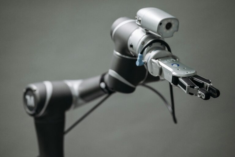 Close-up view of a robotic arm equipped with a video camera, showcasing modern technology.